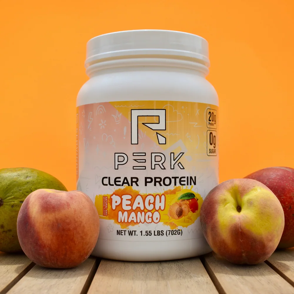 Perk Peach Mango clear protein powder tub in peach-colored packaging